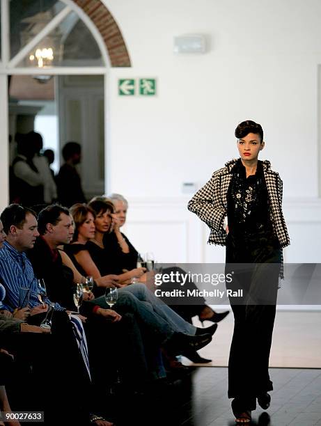 Model exhibits the latest creation of designer Kluk CDGT at the Arise Cape Town Fashion Week at the Val De Vie Winelands Lifestyle Estate on August...