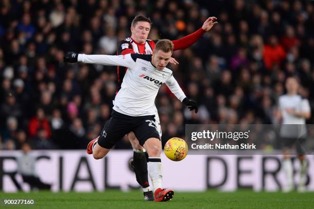 Matej Vydra of Derby County and John Lundstram of Sheffield United in action during the Sky Bet Championship match between Derby County and Sheffield...