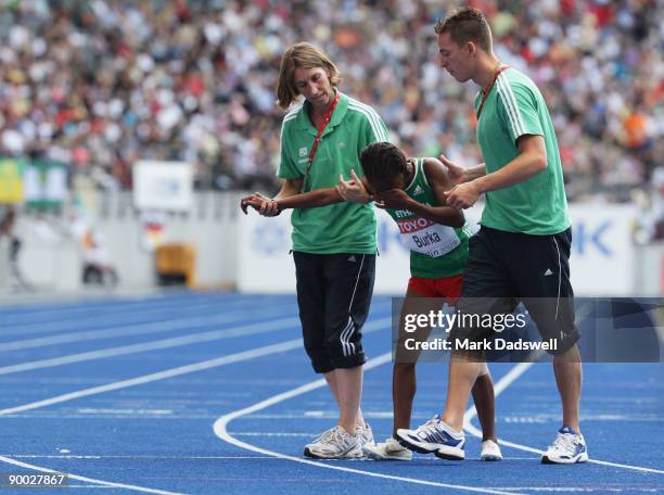 Gelete Burka of Ethiopia is carried from the track in the women's 1500 Metres Final during day nine of the 12th IAAF World Athletics Championships at...