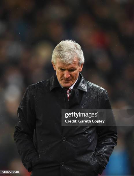 Mark Hughes, Manager of Stoke City looks dejected during the Premier League match between Stoke City and Newcastle United at Bet365 Stadium on...