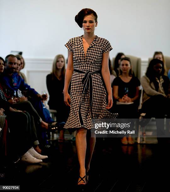 Model exhibits the latest creation of designer Kluk CDGT at the Arise Cape Town Fashion Week at the Val De Vie Winelands Lifestyle Estate on August...