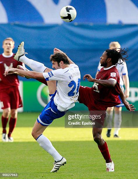 Adrian Ropotan of Dynamo Moscow battles for the ball with MacBeth Sibaya of Rubin Kazan during the Russian Football League Championship match between...