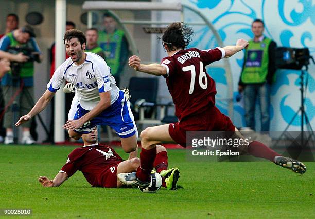 Adrian Ropotan of Dynamo Moscow battles for the ball with Roman Sharonov and Gokdeniz Karadeniz of Rubin Kazan during the Russian Football League...