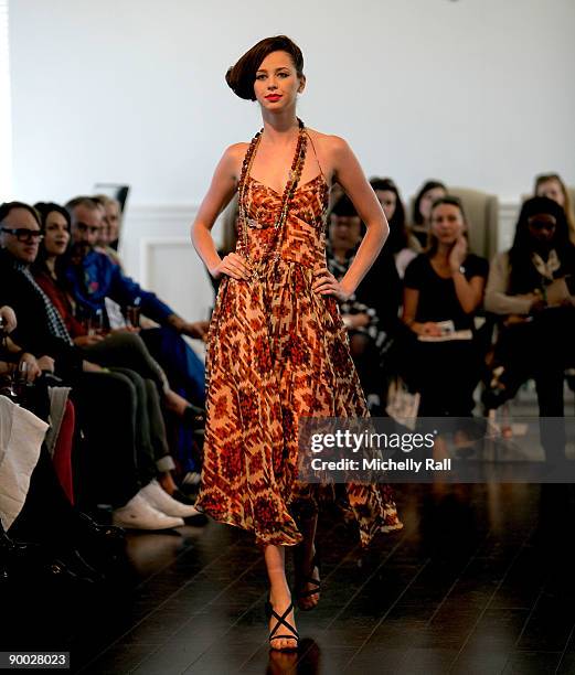 Model exhibits the latest creation of designer Kluk CDGT at the Arise Cape Town Fashion Week at the Val De Vie Winelands Lifestyle Estate on August...