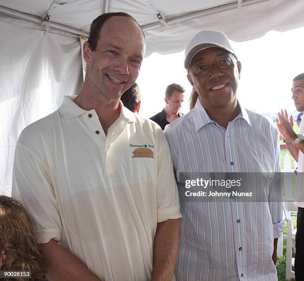 Kevin Yardly and Russell Simmons attend the closing day of the Mercedes-Benz Polo Challenge at Blue Star Jets Field at Two Trees Farm on August 22,...