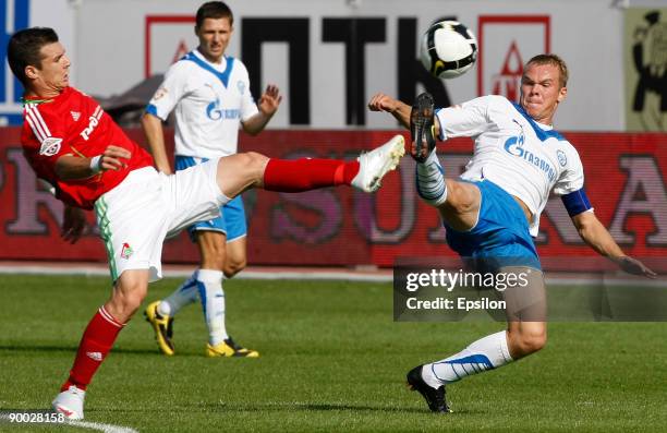 Alexander Anyukov of FC Zenit St. Petersburg battles for the ball with Wagner of FC Lokomotiv Moscow during the Russian Football League Championship...