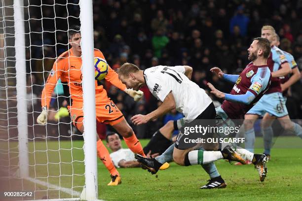 Liverpool's Estonian defender Ragnar Klavan stoops to head home their second goal during the English Premier League football match between Burnley...