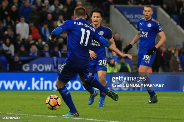 Leicester City's English midfielder Marc Albrighton scores the team's third goal during the English Premier League football match between Leicester...