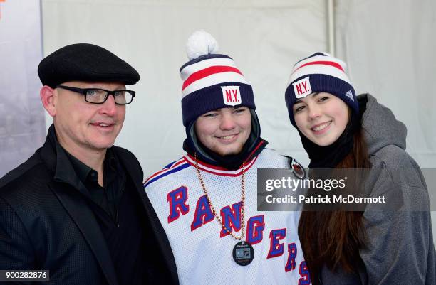Former New York Rangers player, Adam Graves , poses with fans prior to the 2018 Bridgestone NHL Winter Classic between the New York Rangers and the...