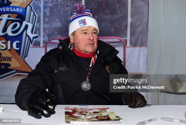 Former New York Rangers player, Rod Gilbert, signs autographs prior to the 2018 Bridgestone NHL Winter Classic between the New York Rangers and the...