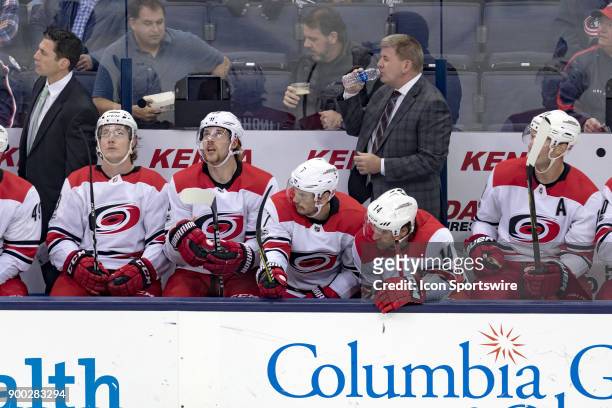 Carolina Hurricanes head coach Bill Peters gets a drink of water during a game between the Columbus Blue Jackets and the Carolina Hurricanes on...