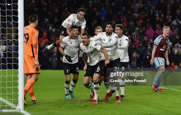 Ragnar Klavan of Liverpool celebrates with his team mates after scoring the winning goal during the Premier League match between Burnley and...