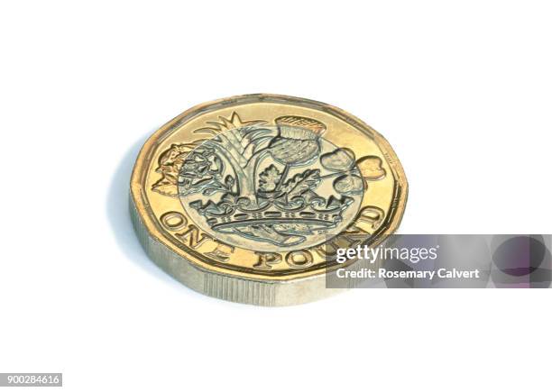 close-up of one pound coin on white, with copy space. - single object stock pictures, royalty-free photos & images