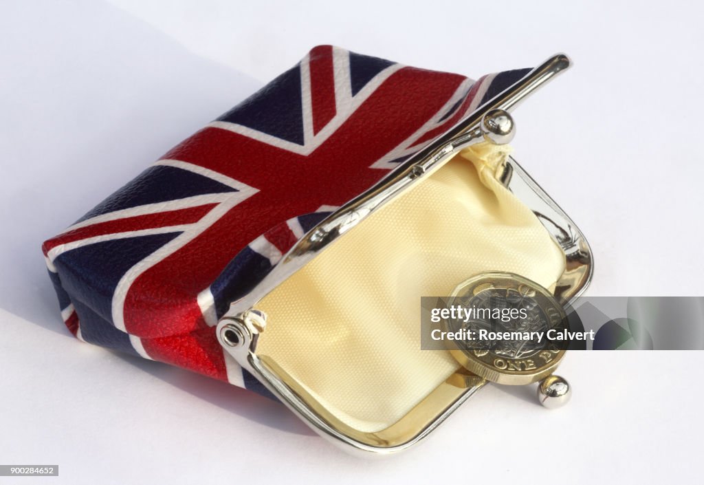 Union jack purse with just one one pound coin in it.