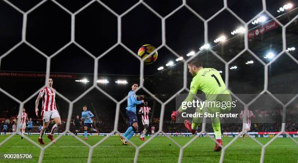 Newcastle striker Ayoze Perez scores the winning goal past Jack Butland during the Premier League match between Stoke City and Newcastle United at...