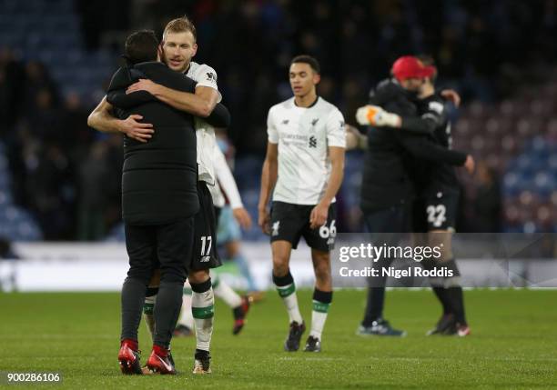 Ragnar Klavan of Liverpool celebrates victory with Zeljko Buvac, Liverpool assistant manager after the Premier League match between Burnley and...