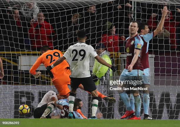Ragnar Klavan of Liverpool scores the winning goal during the Premier League match between Burnley and Liverpool at Turf Moor on January 1, 2018 in...