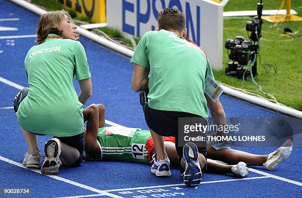 Ethiopia's Gelete Burka gets medical assitance after the women's 1500m final of the 2009 IAAF Athletics World Championships on August 23, 2009 in...