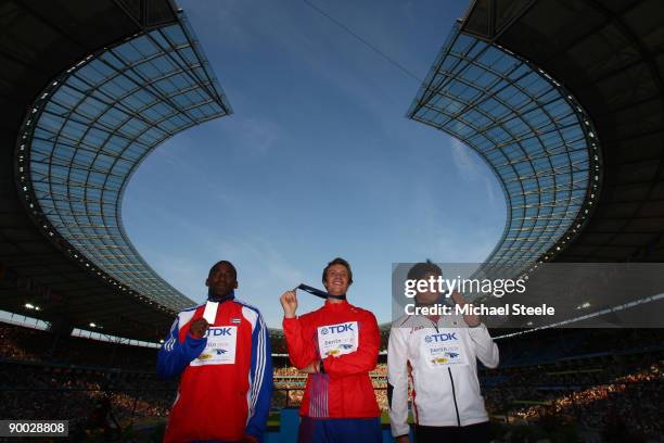 Guillermo Martinez of Cuba receives the silver medal, Andreas Thorkildsen of Norway the gold medal and Yukifumi Murakami of Japan the bronze medal...