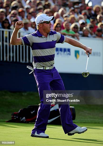 Simon Dyson of England celebrates winning in a playoff against Peter Lawrie of Ireland and Peter Hedblom of Sweden during the final round of The KLM...