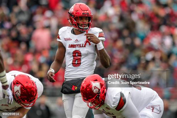 Louisville Cardinals quarterback Lamar Jackson lines up for a play during the game between the Louisville Cardinals and the Mississippi State...