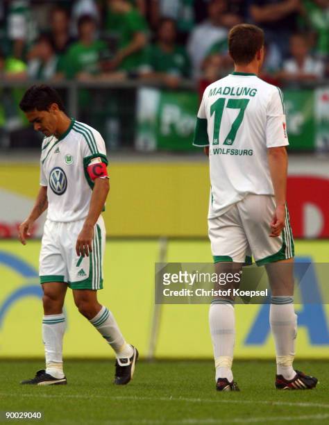 Josué and Alexander Madlung of Wolfsburg look dejected after losing 2-4 the Bundesliga match between VfL Wolfsburg and Hamburger SV at Volkswagen...