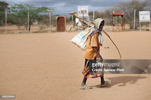 Man walks through the world's biggest refugee complex August 23, 2009 in Dadaab, Kenya. The Dadaab refugee complex in northeastern Kenya, which...