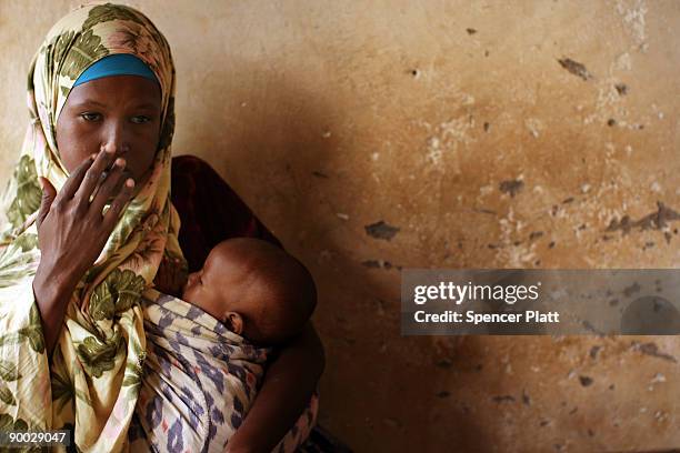 Asha Ahmed Haji sits in a local police station to file charges against her husband, an accused thief and drug user, in the world's biggest refugee...