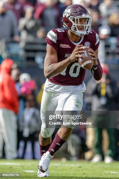 Mississippi State Bulldogs quarterback Keytaon Thompson looks for a receiver during the game between the Louisville Cardinals and the Mississippi...