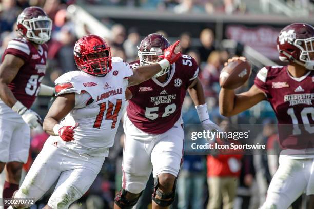 Louisville Cardinals defensive lineman Drew Bailey pressures Mississippi State Bulldogs quarterback Keytaon Thompson during the game between the...