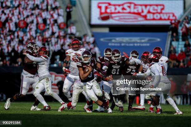 Mississippi State Bulldogs quarterback Keytaon Thompson runs with the ball during the game between the Louisville Cardinals and the Mississippi State...