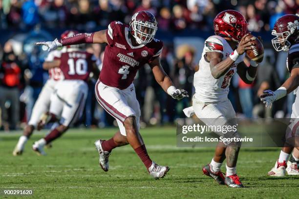 Mississippi State Bulldogs linebacker Gerri Green pressures Louisville Cardinals quarterback Lamar Jackson during the game between the Louisville...