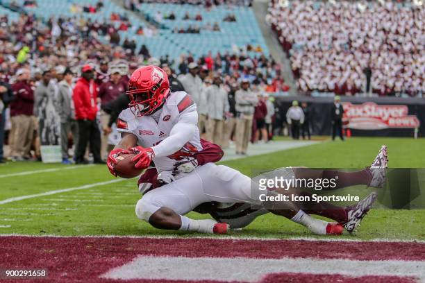 Louisville Cardinals tight end Charles Standberry gets the ball across the goal line for a touchdown during the game between the Louisville Cardinals...