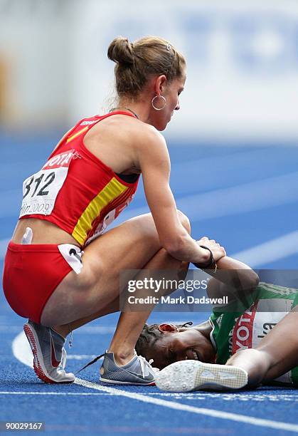 Natalia Rodriguez of Spain stands over Gelete Burka of Ethiopia in the women's 1500 Metres Final during day nine of the 12th IAAF World Athletics...