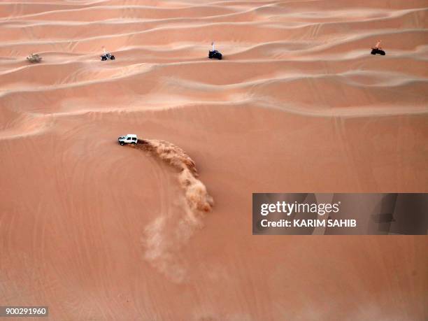 Dune buggy practices during a sand dune racing at the Liwa 2018 Moreeb Dune Festival on January 1 in the Liwa desert, some 250 kilometres west of the...