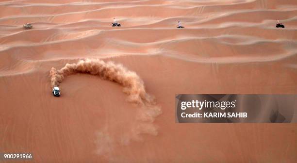 Dune buggy practices during a sand dune racing at the Liwa 2018 Moreeb Dune Festival on January 1 in the Liwa desert, some 250 kilometres west of the...