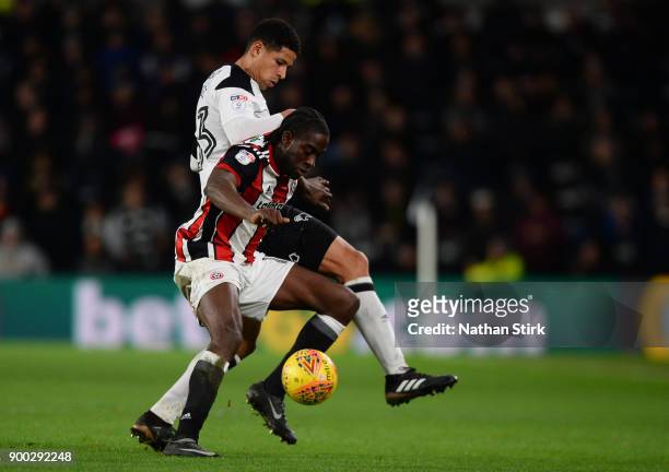 Curtis Davies of Derby County and Clayton Donaldson of Sheffield United in action during the Sky Bet Championship match between Derby County and...