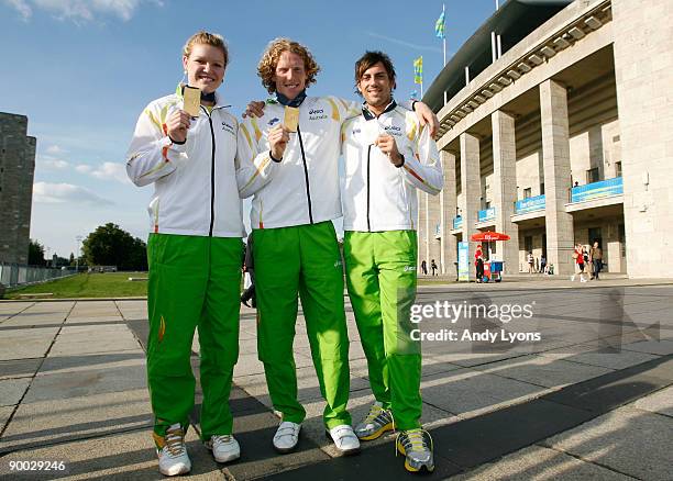 Discus gold medalist Dani Samuels, pole vault gold medalist Steve Hooker and long jump bronze medalist Mitchell Watt of Australia pose with their...