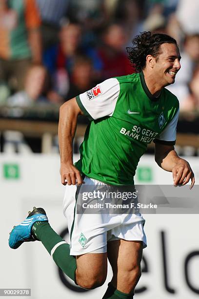 Claudio Pizarro of Bremen celebrate their teams first goal during the Bundesliga match between Werder Bremen and Borussia Moenchengladbach at the...