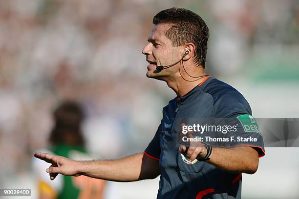 Referee Guenter Perl reacts during the Bundesliga match between Werder Bremen and Borussia Moenchengladbach at the Weser Stadium on August 23, 2009...