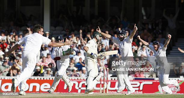 England's Graeme Swann celebrates after taking the final wicket of Australia's Michael Hussey and England win the Ashes after they win on the fourth...