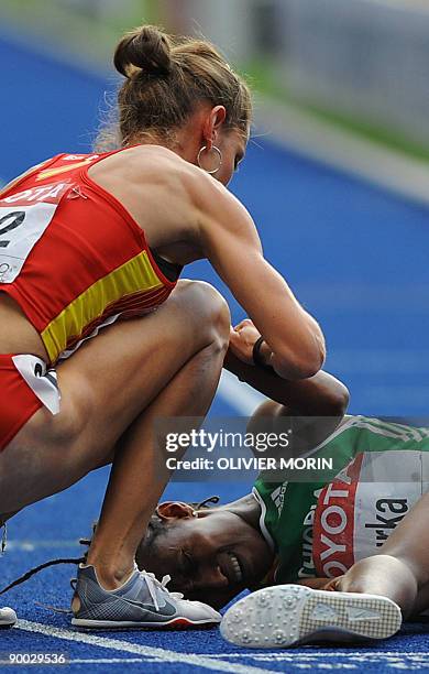 Spain's Natalia Rodríguez talks to Ethiopia's Gelete Burka after the women's 1500m final of the 2009 IAAF Athletics World Championships on August 23,...