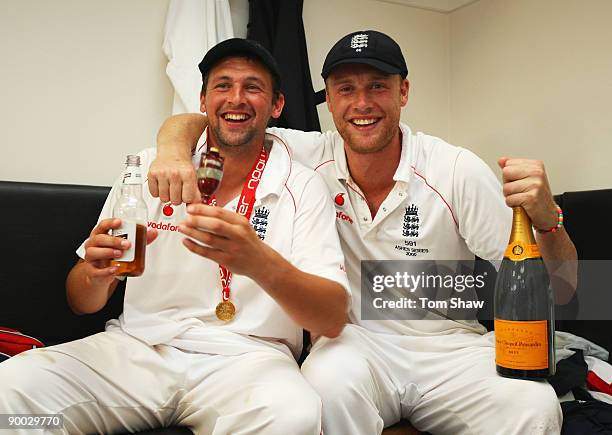 Andrew Flintoff of England poses with Steve Harmison and the Ashes urn in the dressing room after day four of the npower 5th Ashes Test Match between...