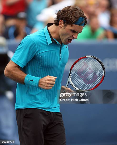 Roger Federer of Switzerland celebrates winning match point against Novak Djokovic of Serbia in the Singles Final during day seven of the Western &...
