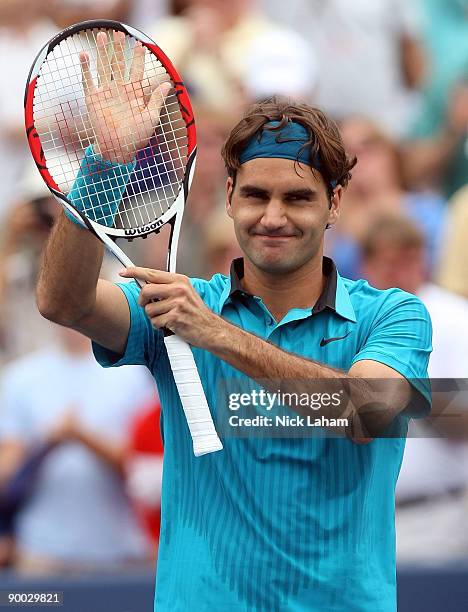 Roger Federer of Switzerland waves to the crowd after defeating Novak Djokovic of Serbia in the Singles Final during day seven of the Western &...