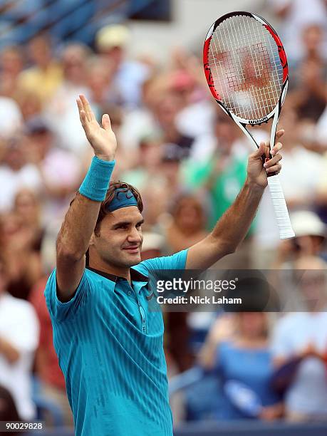 Roger Federer of Switzerland waves to the crowd after defeating Novak Djokovic of Serbia in the Singles Final during day seven of the Western &...