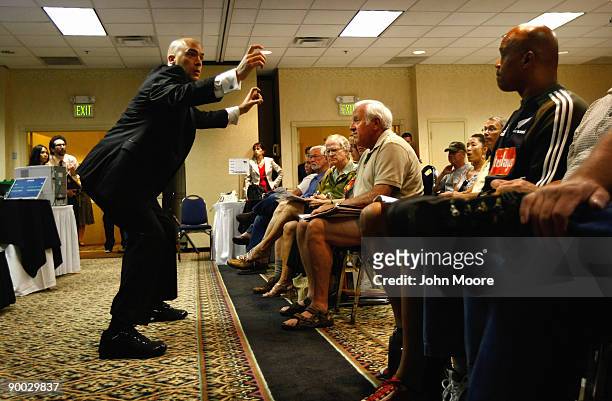 Auctioneer J.J. Johnston scans the crowd for bids on a foreclosed home during an auction on August 23, 2009 in Denver, Colorado. Some 40 Colorado...