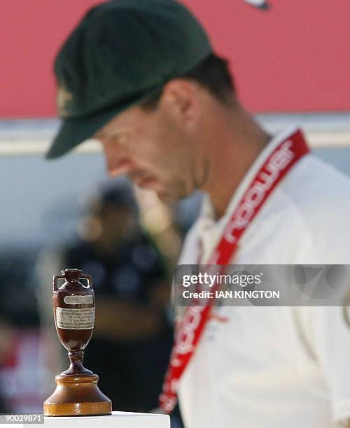 Australia's Captain Ricky Ponting walks past the Ashes Urn after England win on the fourth day of the fifth and final Ashes cricket Test match...