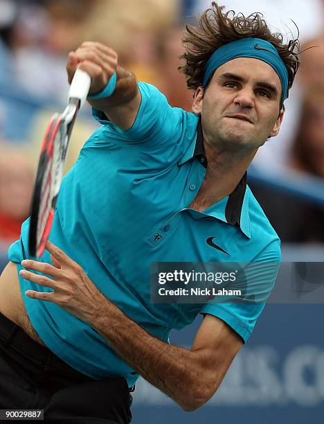 Roger Federer of Switzerland serves against Novak Djokovic of Serbia in the Singles Final during day seven of the Western & Southern Financial Group...