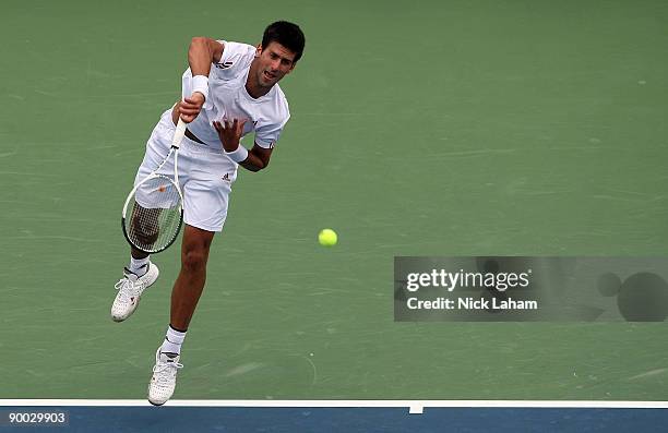 Novak Djokovic of Serbia serves against Roger Federer of Switzerland in the Singles Final during day seven of the Western & Southern Financial Group...